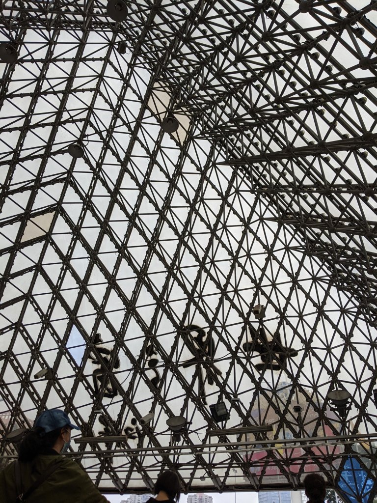 Inside the glass pyramid metro exit