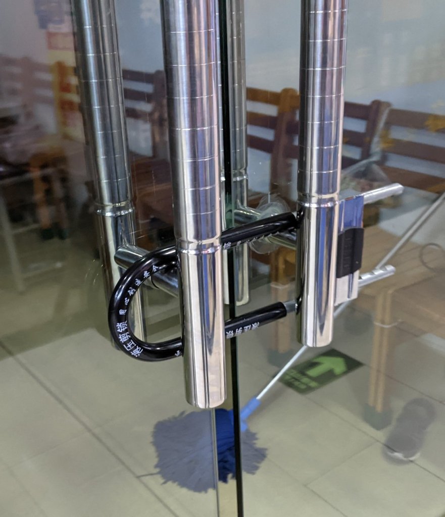 Bicycle lock holding a couple sliding glass doors together