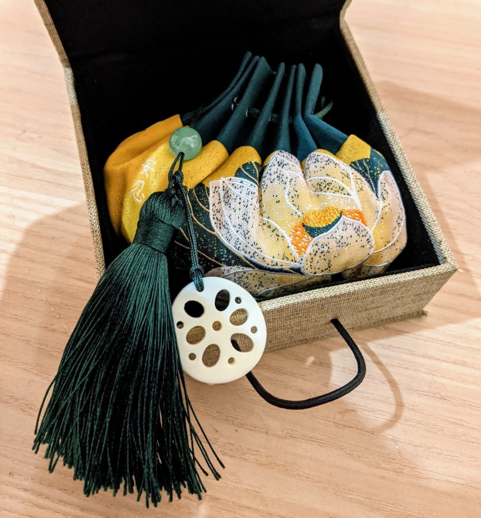 A little green and gold sachet, or bag, in a box that I got to celebrate Dragon Boat Festival.